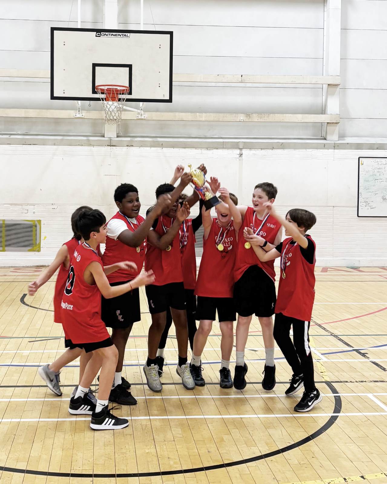 Y7 boys basketball Camden trophy lift